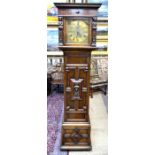 Maple, London, a Flemish Revival style oak 8-day longcase clock, the movement chiming on five coiled