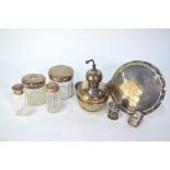 Five various cut glass toilet jars with silver mounts, including scent atomiser, to/w a silver-