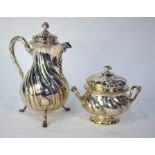 An 800 grade pear-shaped coffee pot in the 18th century manner, with spiral reeded decoration, to/