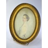 A small 19th century watercolour oval portrait of a young woman in muslin dress, unsigned, 19 x 14