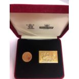 A Royal Mint and Royal Mail presentation set comprising Queen Elizabeth II 2001 gold sovereign and