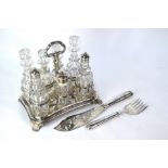 An Old Sheffield Plate cruet stand fitted with seven cut glass bottles and jars - three with