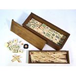 A bone and bamboo Mah Jong set in fitted box144 pieces