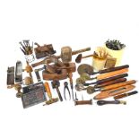 An interesting collection of vintage woodworker's tools, leather-worker's book-binding stamps and