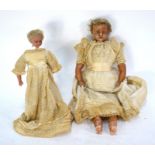 A 19th century doll with wax head and limbs, fixed blue eyes, closed mouth, cropped blonde wig,