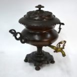 A Regency copper samovar urn with brass tap, on stemmed base and bun feet, 43 cm highDent on back