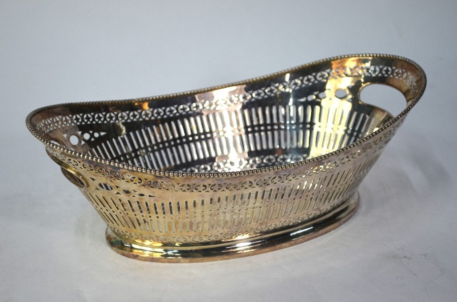 A Continental 800 grade pierced oval basket with beaded rim and end handles, 15.8 oz, 30 cm long
