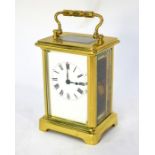 A French lacquered brass carriage clock, 12 cm h