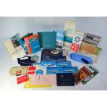 A collection of BOAC memorabilia and pamphlets, including flight slippers, sick bag, etc.