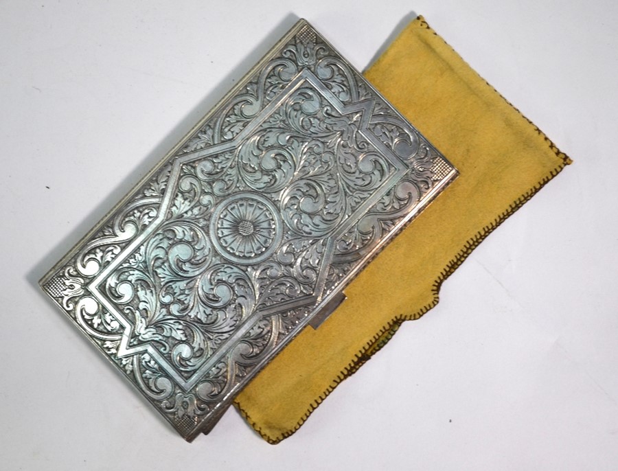 A good quality low grade silver cigarette case, profusely engraved with arabesque gryphons and