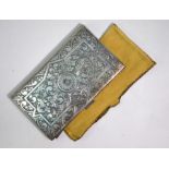 A good quality low grade silver cigarette case, profusely engraved with arabesque gryphons and