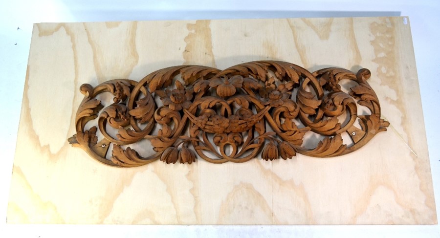 A carved limewood festoon panel in the manner of Grinling Gibbons, 19th century