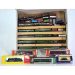 A quantity of boxed N gauge model railway rolling stock including carriages, trucks, wagons etc by