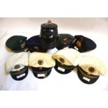 Nine vintage German police hats to include a hard example from Nordrhein Westfalia, Hamberg, Railway