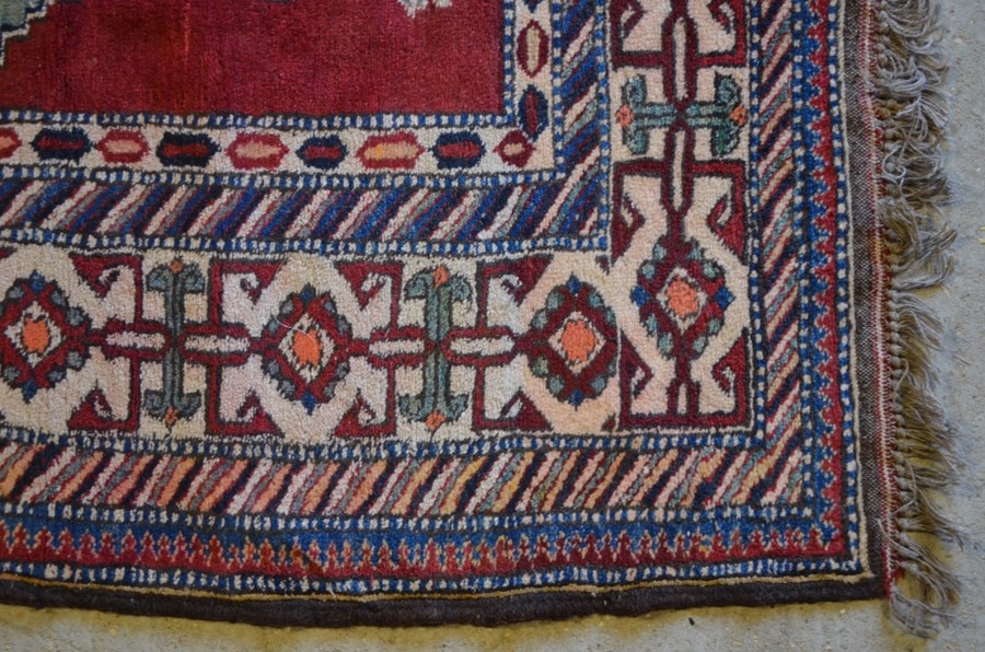 A Caucasian design Afghan carpet, the geometric star motifs on red-brown ground, 2.11 x 2.08 m - Image 2 of 3