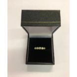A five-stone graduated diamond ring, yellow metal set stamped 18ct, size L