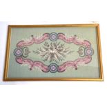A gilt framed and glazed Berlin work wool and beaded panel with pale green ground and pink/blue/grey