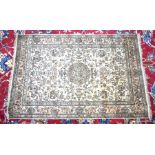 A Turkish part silk Qum rug, the central floral medallion on old gold ground with various animals