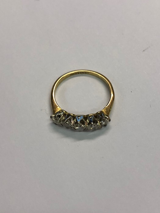 A five-stone graduated diamond ring, yellow metal set stamped 18ct, size L - Image 2 of 2