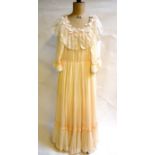 A 1980s bespoke pale peach silk chiffon wedding dress with silk underskirt with deep antique