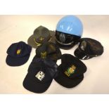 An American police motorcycle helmet, two American police hats and four police caps