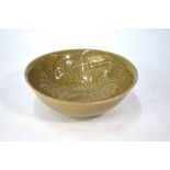 A Northern Song style Celadon bowl, decorated with bold floral designs in the interior, 18 cm