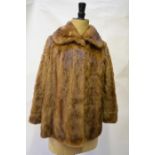 A shadowed light brown mink jacket with neat collar, 52 cm across chestGood worn condition, slight