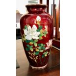 A Japanese ginbari, red-ground vase, decorated with a floral design and white metal rims; 18.5 cm