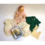A 1940s Pedigree hand plastic doll to/w a collection of vintage doll's clothes, a small