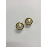 A pair of mabe pearl earrings in yellow metal mounts stamped 750, post fittings for pierced ears,