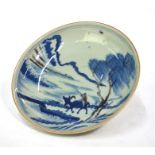 An underglaze blue and yu li hung decorated dish of circular form, decorated with a boy seated on