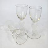 Three Lalique 'Strasbourg' pattern liqueur glasses with figural stems, etched script 'R. Lalique',