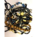 A mixed lot of vintage and later necklaces including simulated pearls, Venetian glass beads,