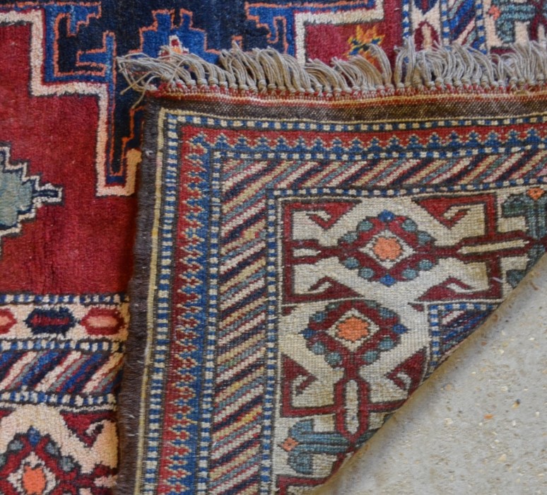 A Caucasian design Afghan carpet, the geometric star motifs on red-brown ground, 2.11 x 2.08 m - Image 3 of 3