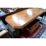 Art Deco walnut dining table in the style of Epstein, the rectangular top with canted corners,