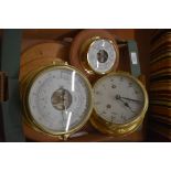 A brass cased Royal Mariner twin train clock, a teak mounted Schatz barometer and another FCC.