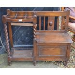 Oak box seated settle with integrated six division stick stand  and barley twist supports