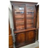 Victorian mahogany chiffonier bookcase with glazed doors over panelled cupboards raised on a