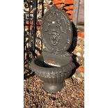 A classically styled cast alloy garden wall feature fountain and trough