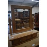 A pine dressing table mirror with two drawers beneath to/w a pine magazine trough and two towel