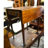 A 19th century mahogany Pembroke table with opposing end drawers raised on tapering square supports