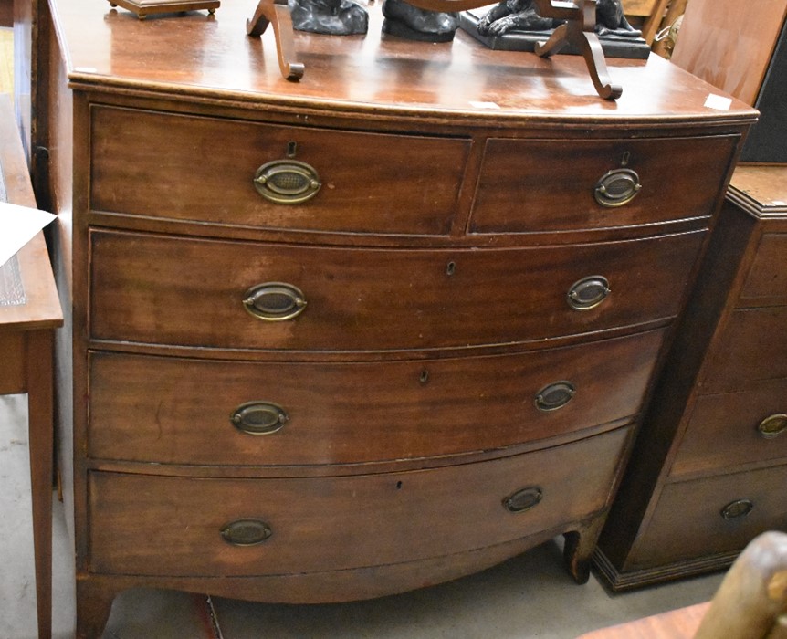 A 19th century mahogany chest of two short over three long drawers raised on splayed bracket feet