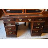 Oak twin pedestal desk, nine drawers with brass handles