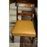 A pair of barback mahogany side chairs with tan leather seats