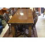 Oak refectory table with rectangular three plank top raised on chamfered square supports with