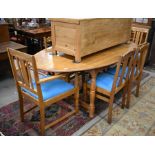 Oak dining table with oval top with moulded edge raised on turned legs with stretchers to/w six