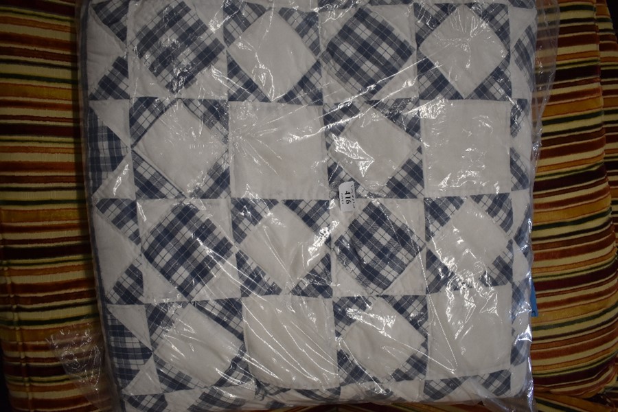 A machined blue/white gingham patchwork quilt