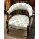 A mahogany framed bedroom armchair with floral upholstery