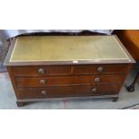 A mahogany low chest with gilt tooled leather top over two short and two long drawers raised on