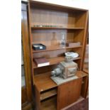 G Plan style teak bookcase with open shelves over sliding cupboards doors